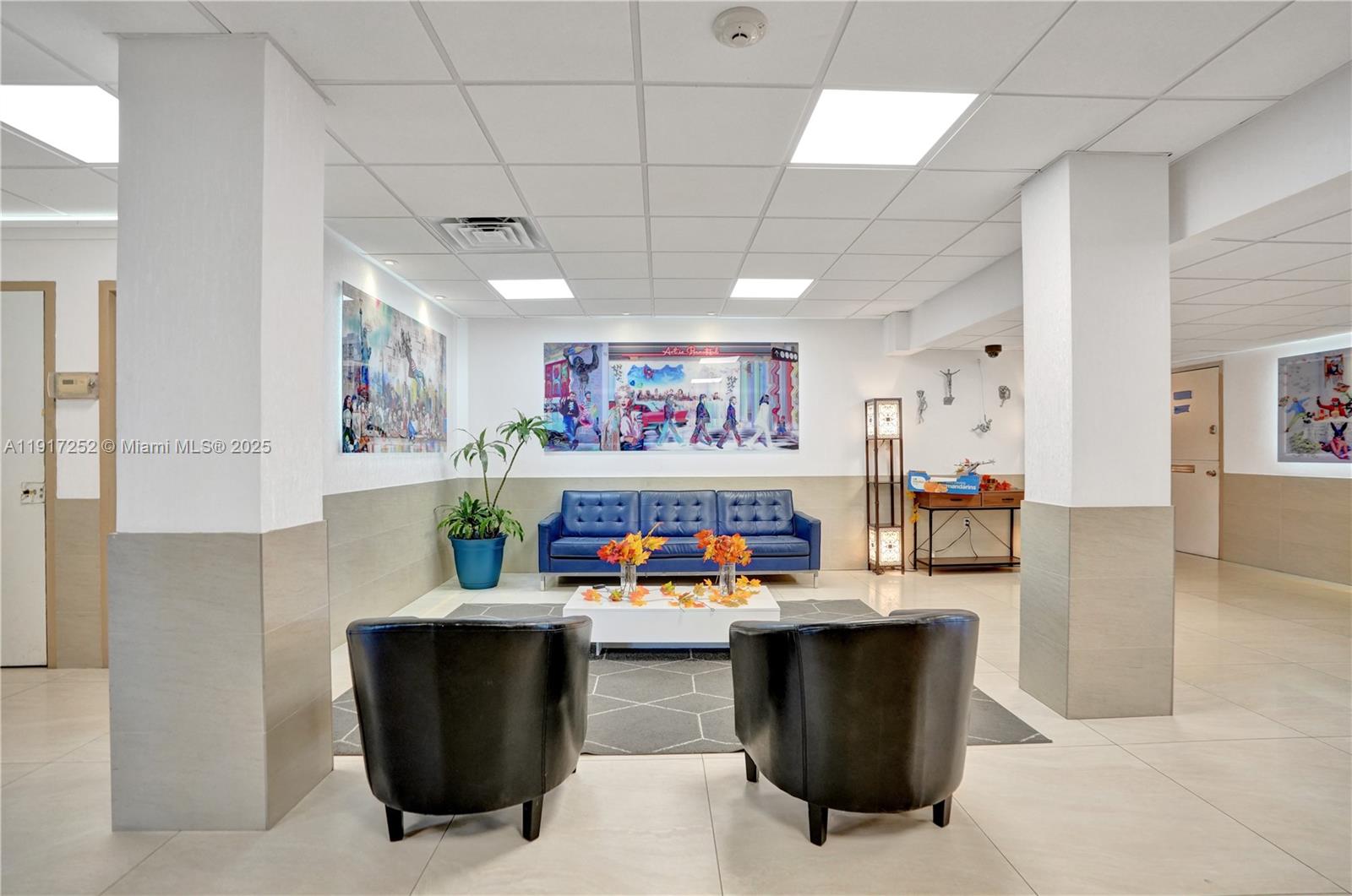 4164 Inverrary Drive, Unit 305 Lauderhill, FL 33319 - Photo 36 of 40 a kitchen with stainless steel appliances kitchen island granite countertop a refrigerator and a sink