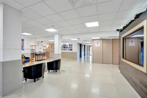 a sign broad in front of flowers