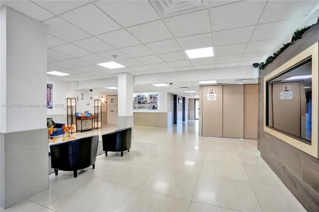 a sign broad in front of flowers