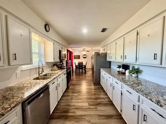 a large kitchen with lot of counter space