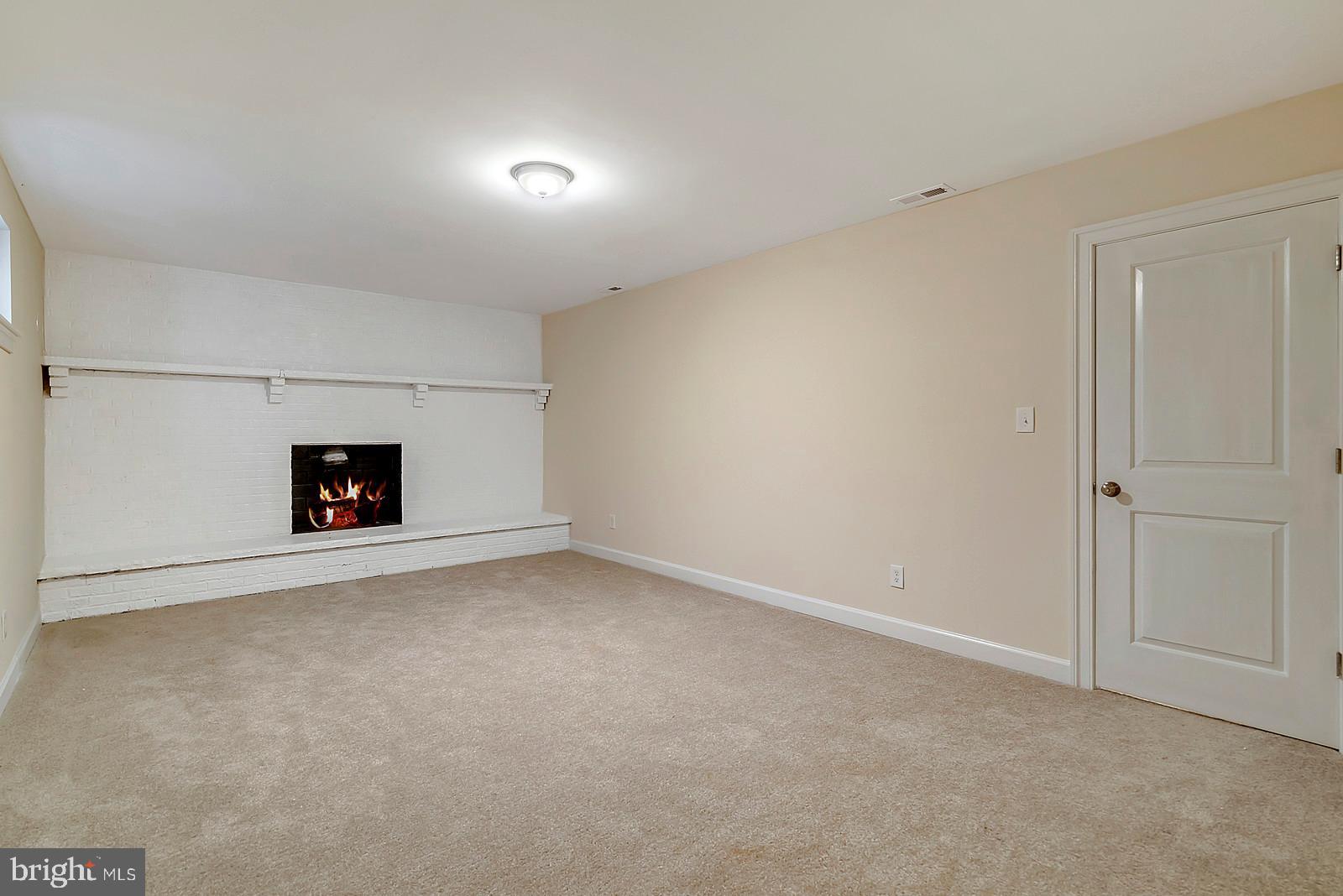 7699 Kennedy Road Nokesville, VA 20181 - Photo 22 of 40 Family Room in basement with Firepalce