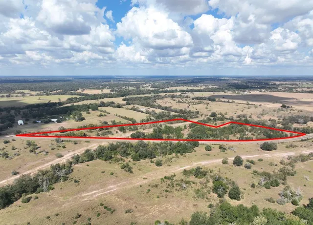a view of a backyard of the house