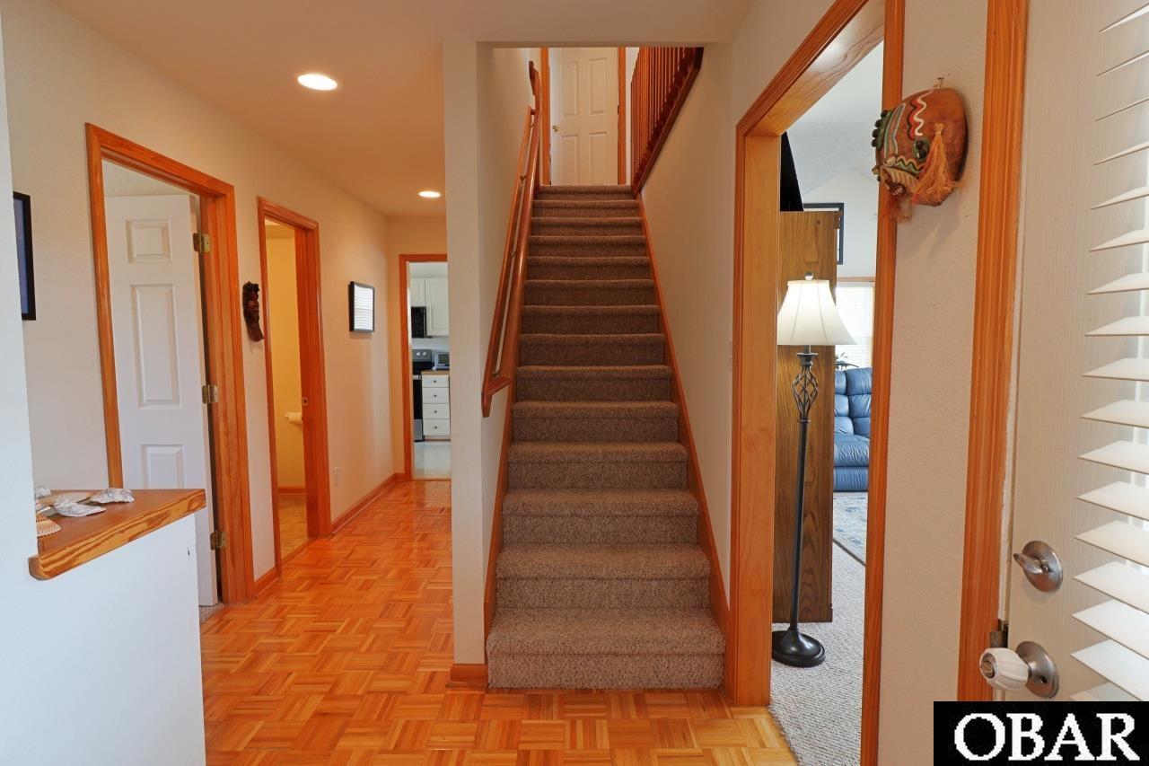 303 Ridgeview Way, Unit 23 Nags Head, NC 27959 - Photo 22 of 50 Hallway and Stairs to third floor from 2nd floor