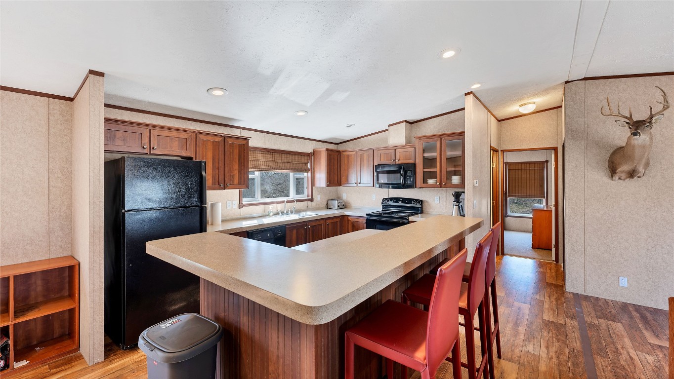 154 Cowboy Road Gonzales, TX 78629 - Photo 11 of 39 a kitchen and a dining table with chairs