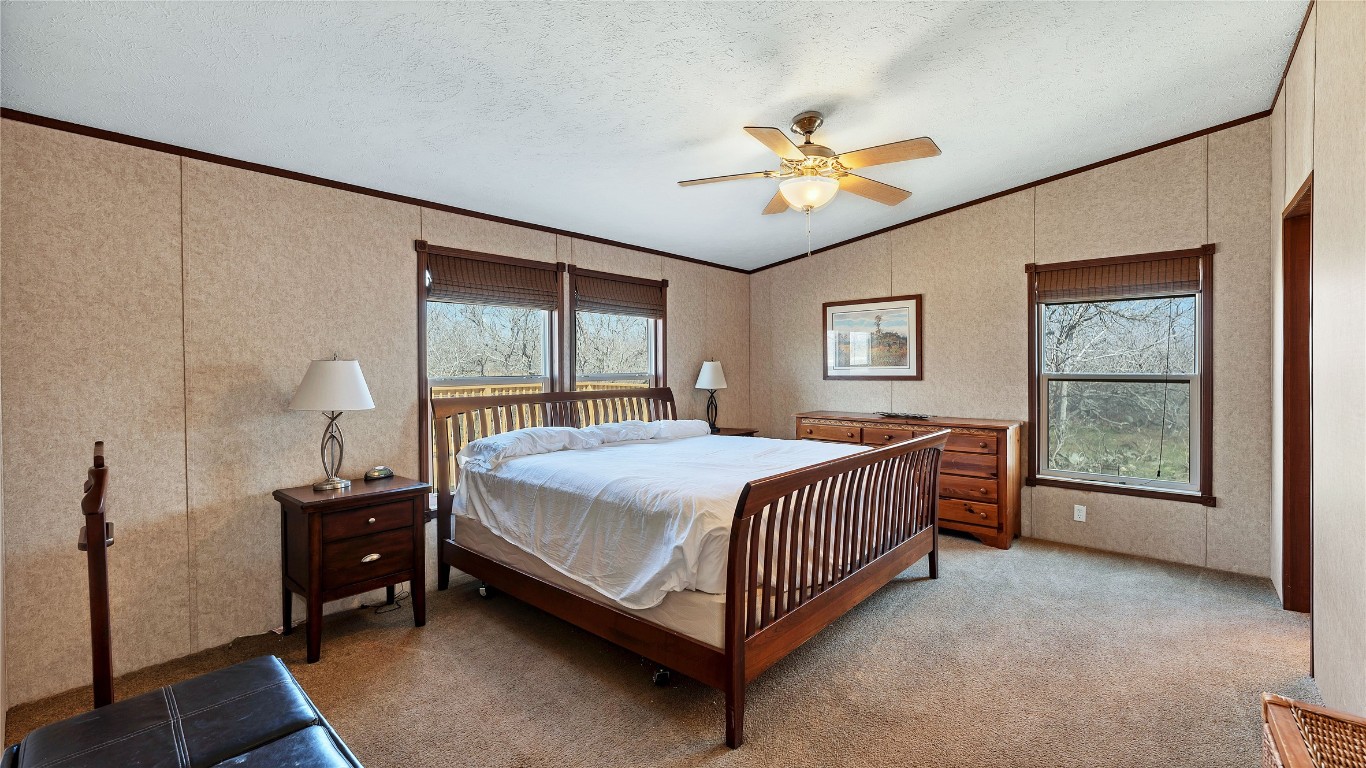 154 Cowboy Road Gonzales, TX 78629 - Photo 17 of 39 a bedroom with a bed and a window