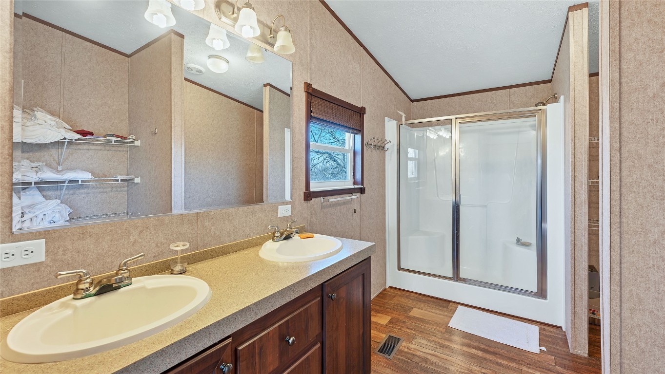 154 Cowboy Road Gonzales, TX 78629 - Photo 21 of 39 a bathroom with a sink double vanity and a mirror