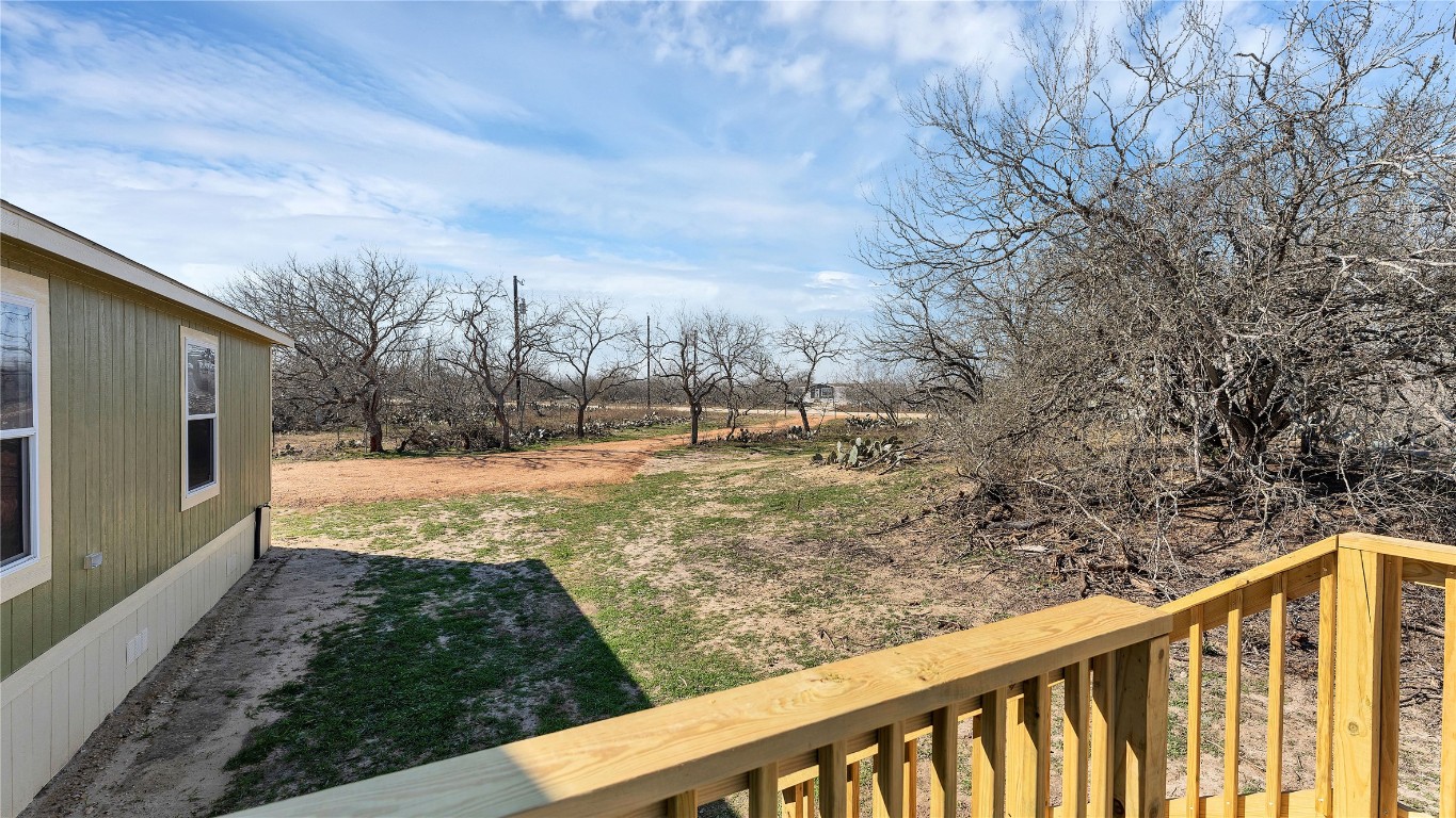 154 Cowboy Road Gonzales, TX 78629 - Photo 28 of 39 a view of a yard with wooden fence
