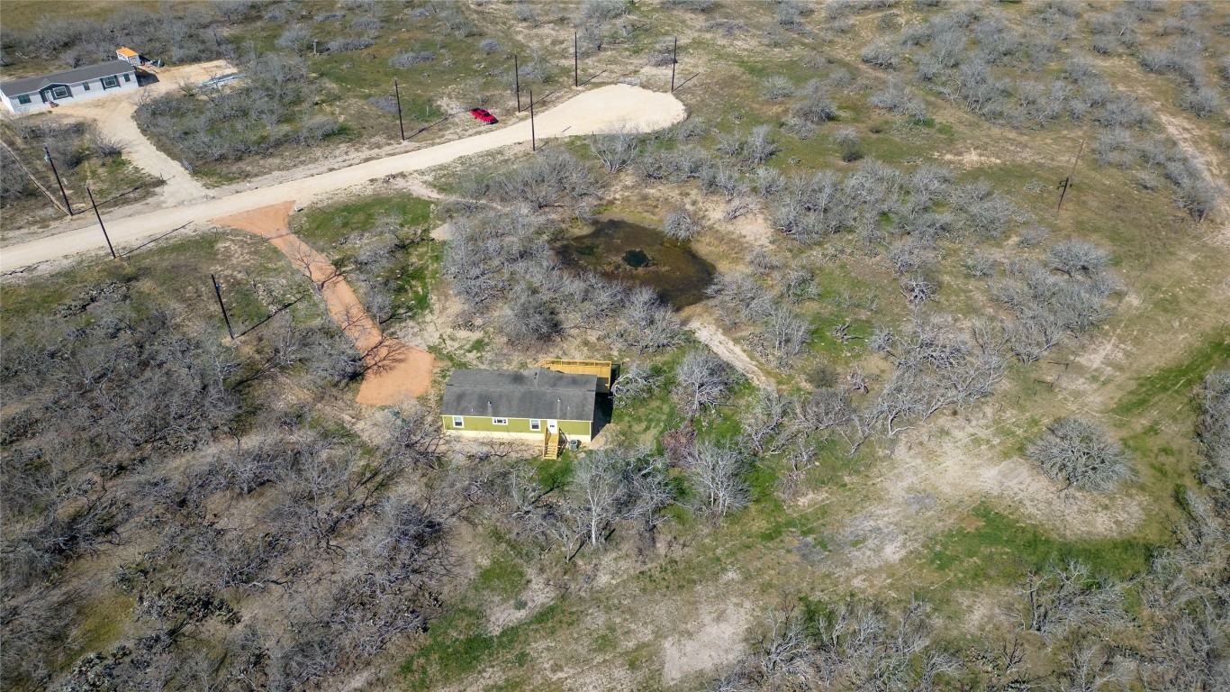 154 Cowboy Road Gonzales, TX 78629 - Photo 38 of 39 a aerial view of a house with a yard and large tree