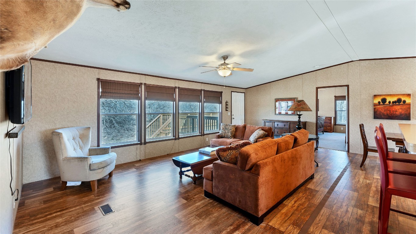 154 Cowboy Road Gonzales, TX 78629 - Photo 8 of 39 a living room with furniture and a flat screen tv