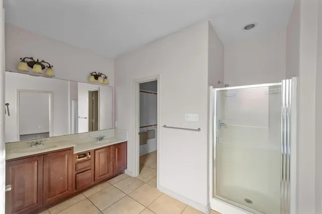 a bathroom with a bathtub sink and mirror
