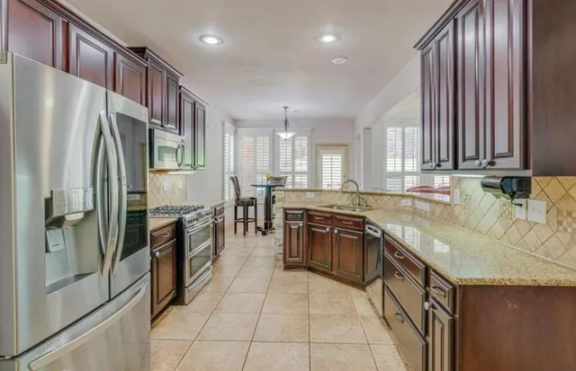 a bathroom with a sink a mirror and a shower