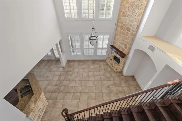 a kitchen with stainless steel appliances granite countertop a sink and a refrigerator