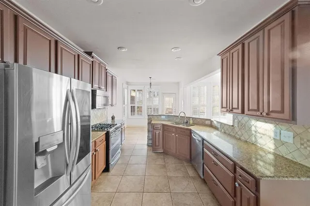 a view of entryway and hall with a fireplace