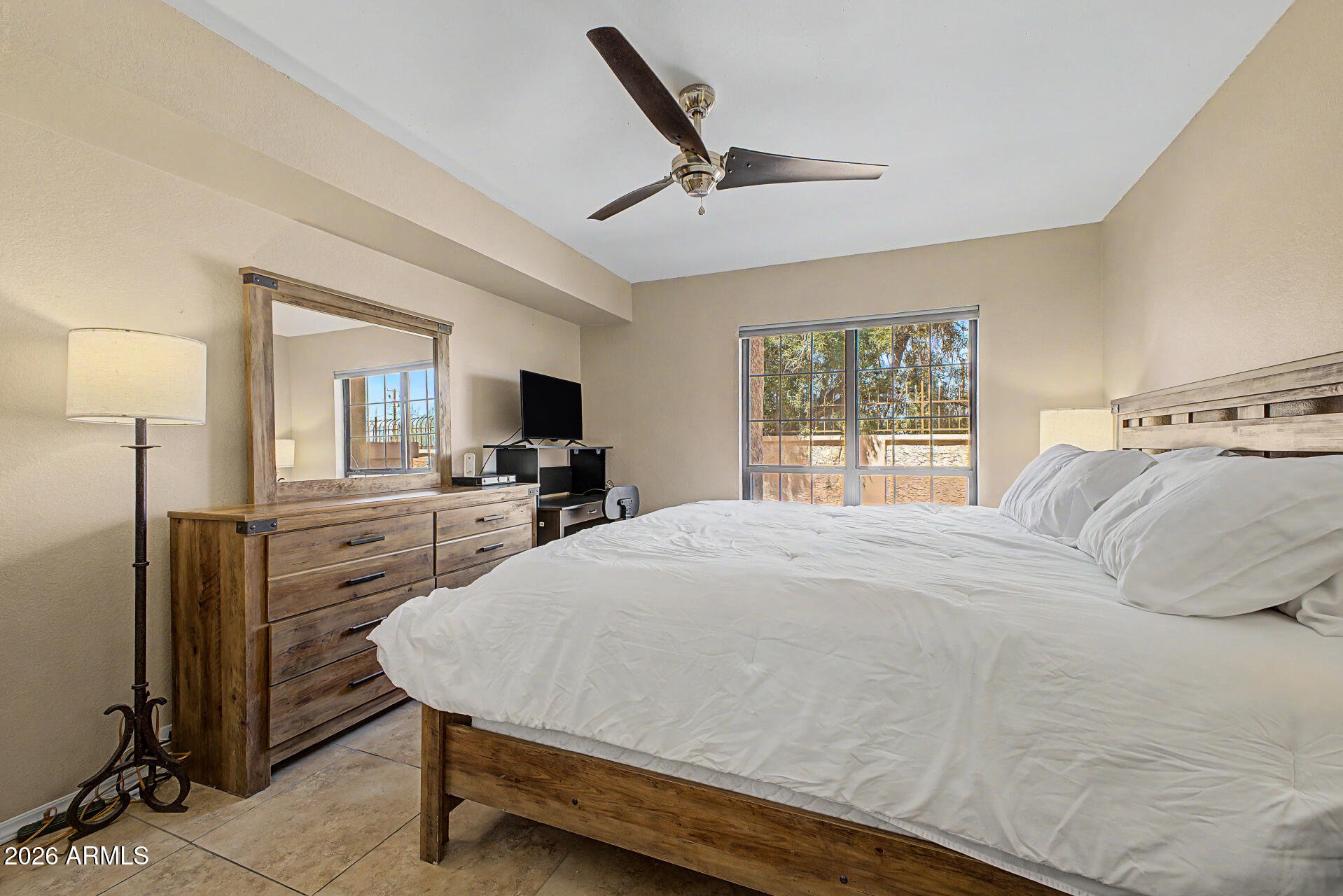10410 North Cave Creek Road, Unit 1027 Phoenix, AZ 85020 - Photo 13 of 37 a bedroom with a bed and a dresser