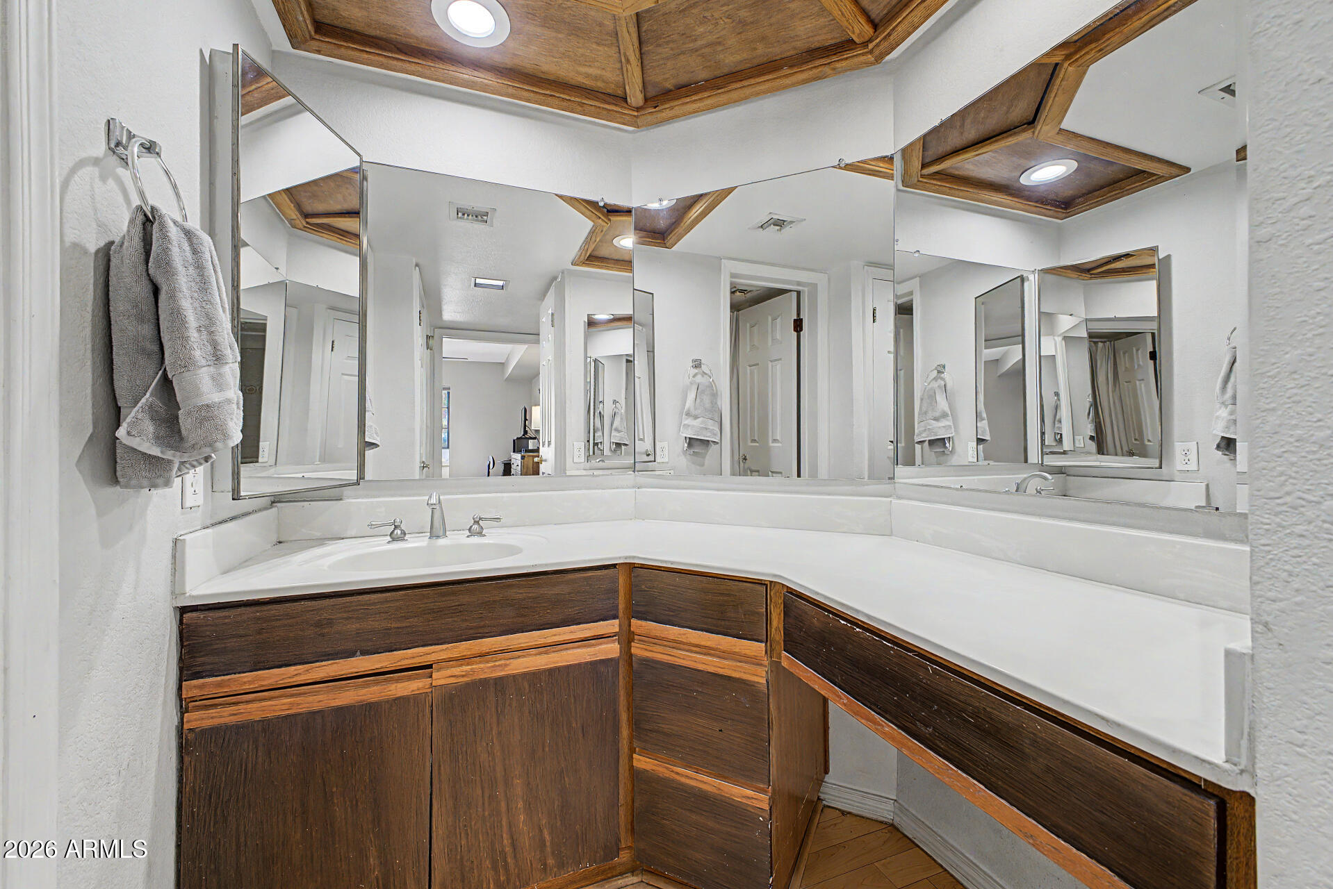 10410 North Cave Creek Road, Unit 1027 Phoenix, AZ 85020 - Photo 15 of 37 a bathroom with a sink and a mirror