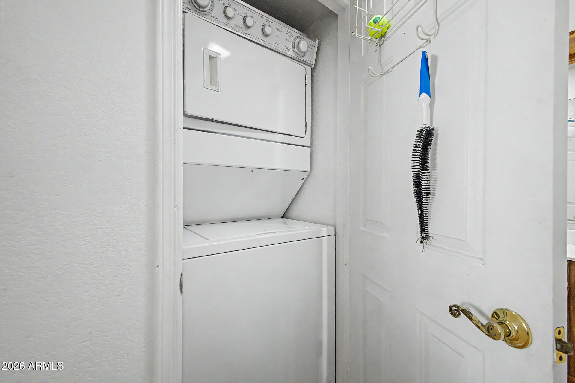 10410 North Cave Creek Road, Unit 1027 Phoenix, AZ 85020 - Photo 19 of 37 a utility room with dryer and washer