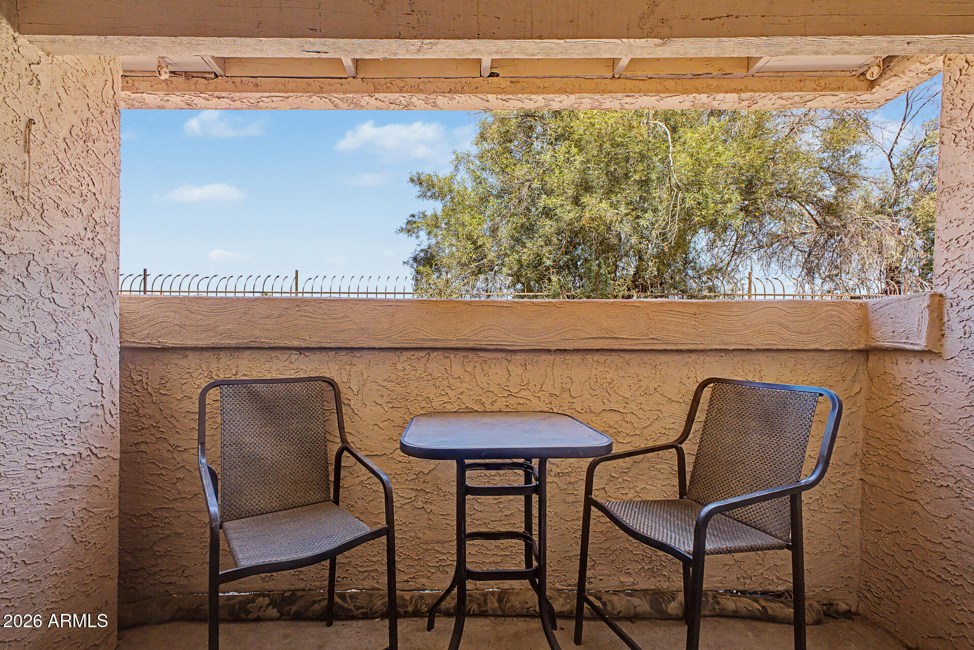 10410 North Cave Creek Road, Unit 1027 Phoenix, AZ 85020 - Photo 20 of 37 a view of a chair and table in the balcony