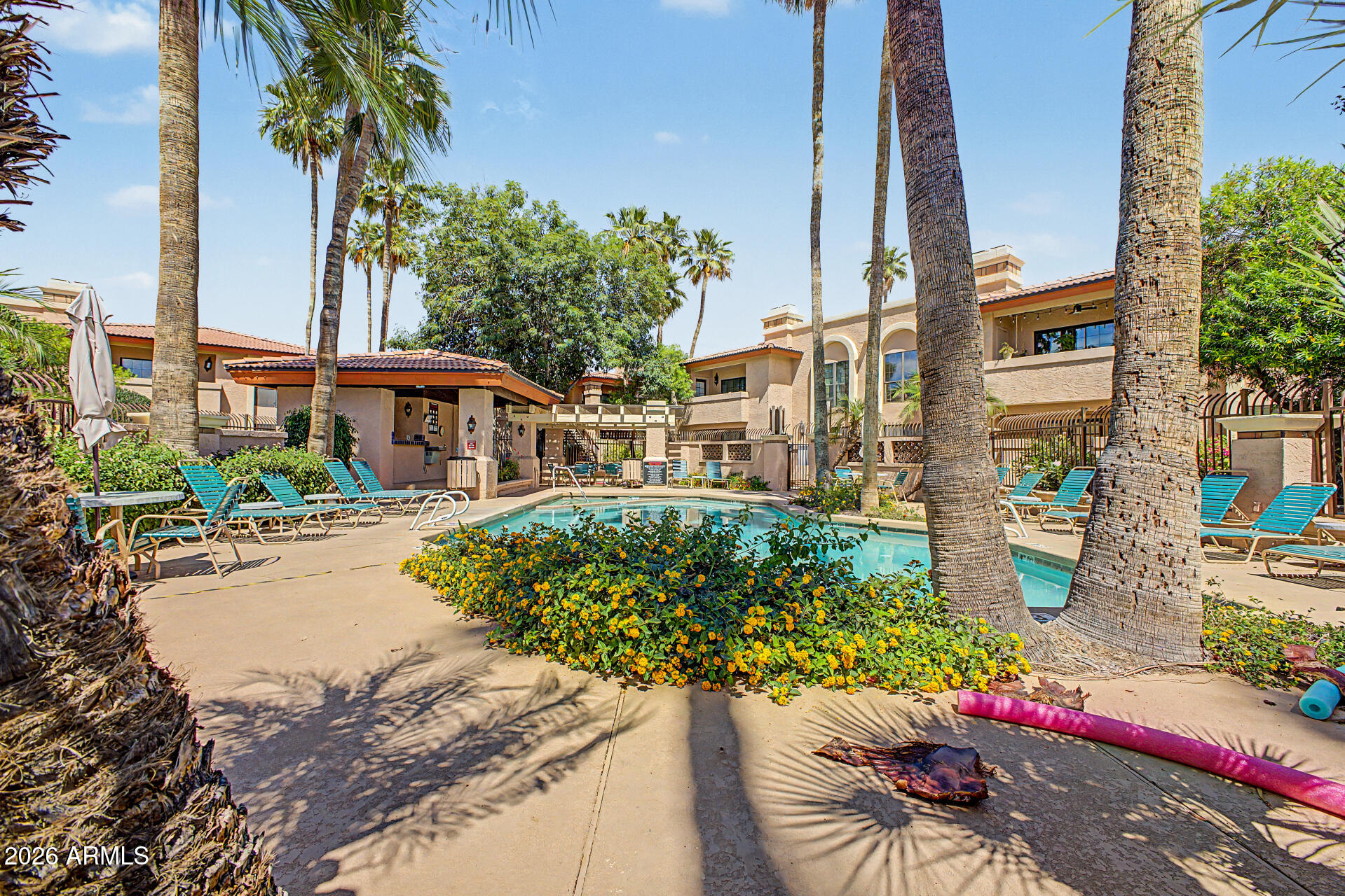 10410 North Cave Creek Road, Unit 1027 Phoenix, AZ 85020 - Photo 22 of 37 a view of a house with a yard and sitting area