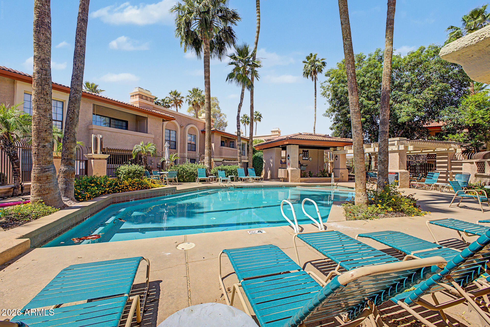 10410 North Cave Creek Road, Unit 1027 Phoenix, AZ 85020 - Photo 23 of 37 a view of a patio with swimming pool table and chairs