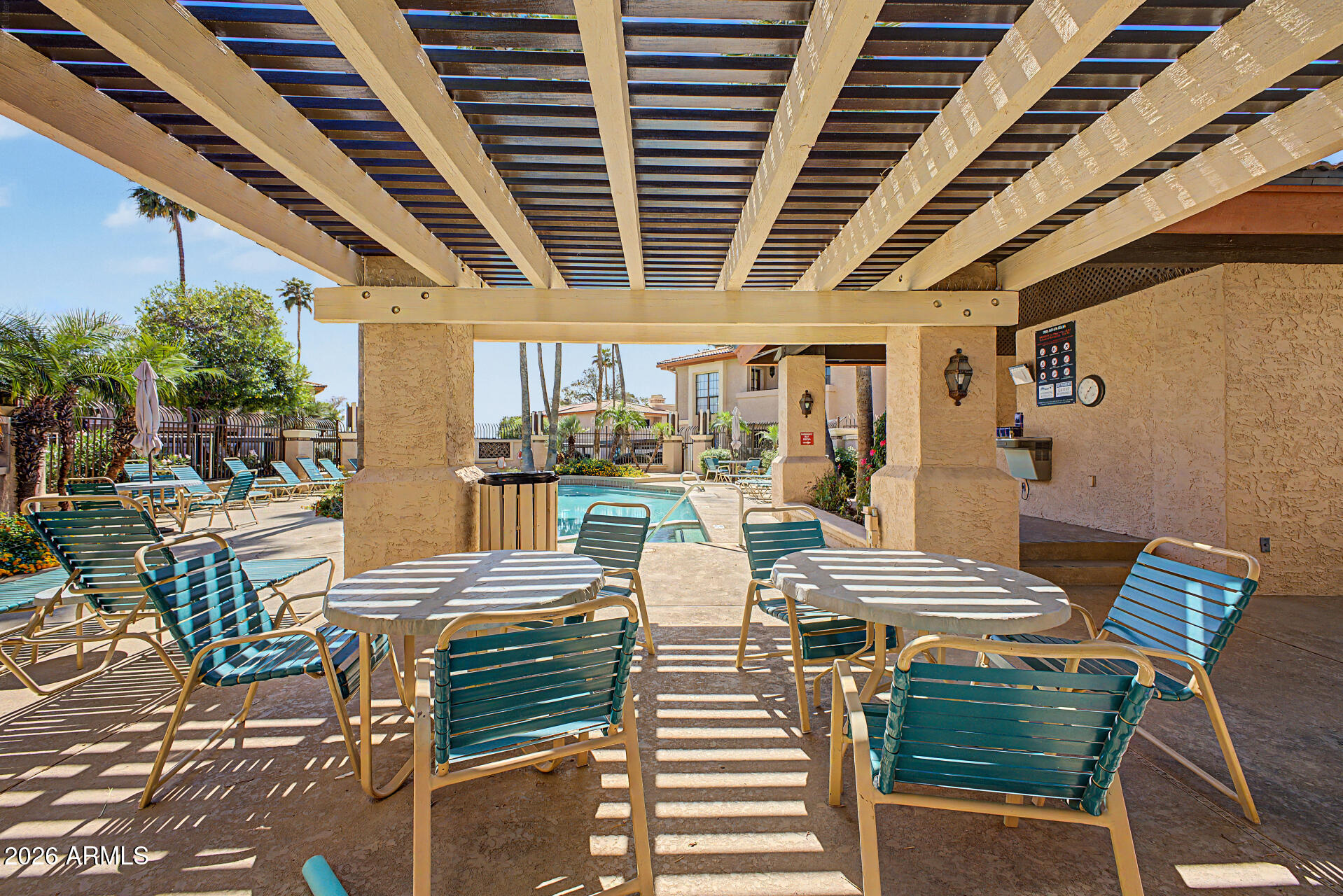 10410 North Cave Creek Road, Unit 1027 Phoenix, AZ 85020 - Photo 24 of 37 a view of a patio with couches chairs and a table and chairs with wooden floor