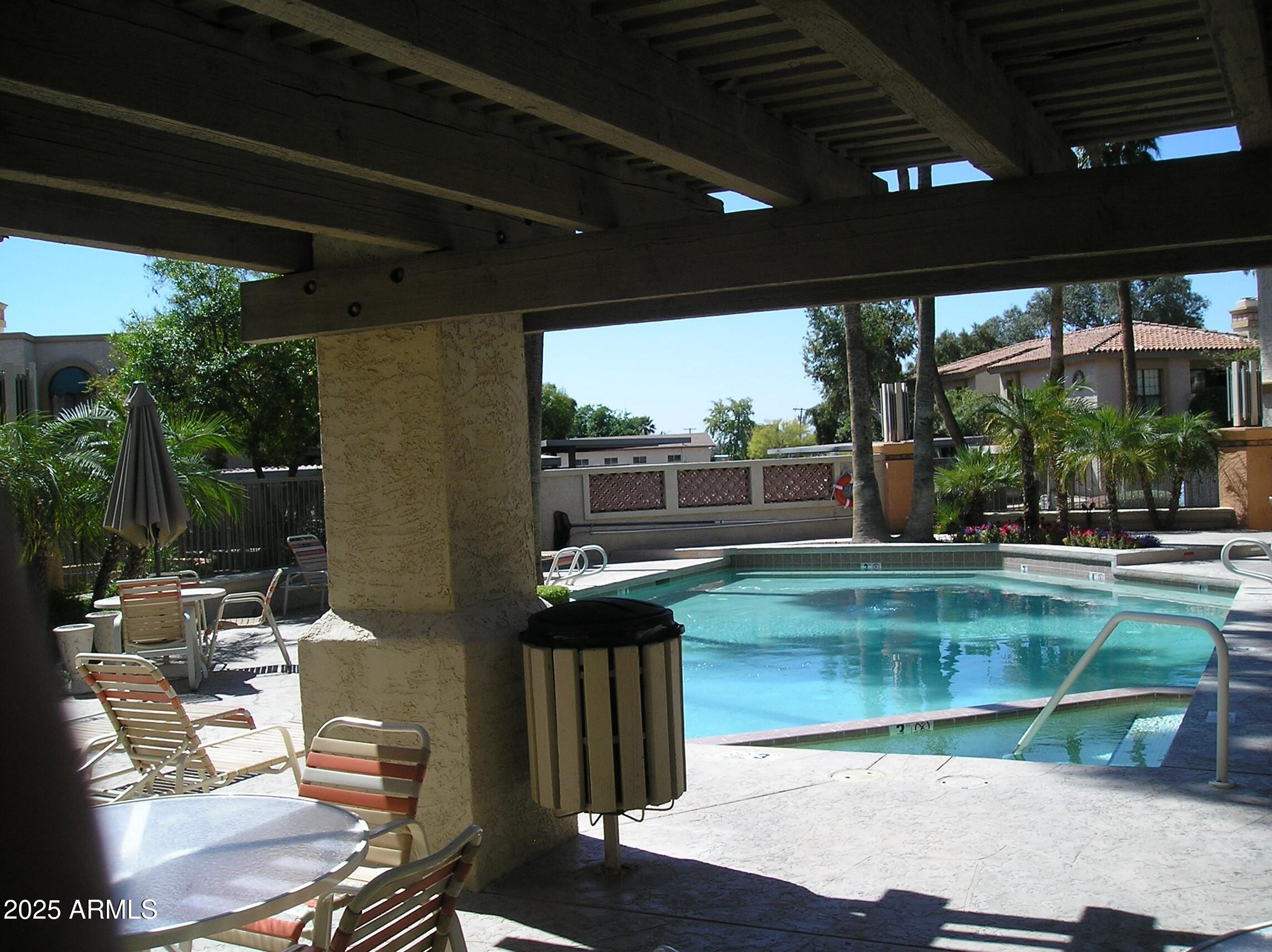 10410 North Cave Creek Road, Unit 1027 Phoenix, AZ 85020 - Photo 26 of 37 a view of swimming pool with a patio
