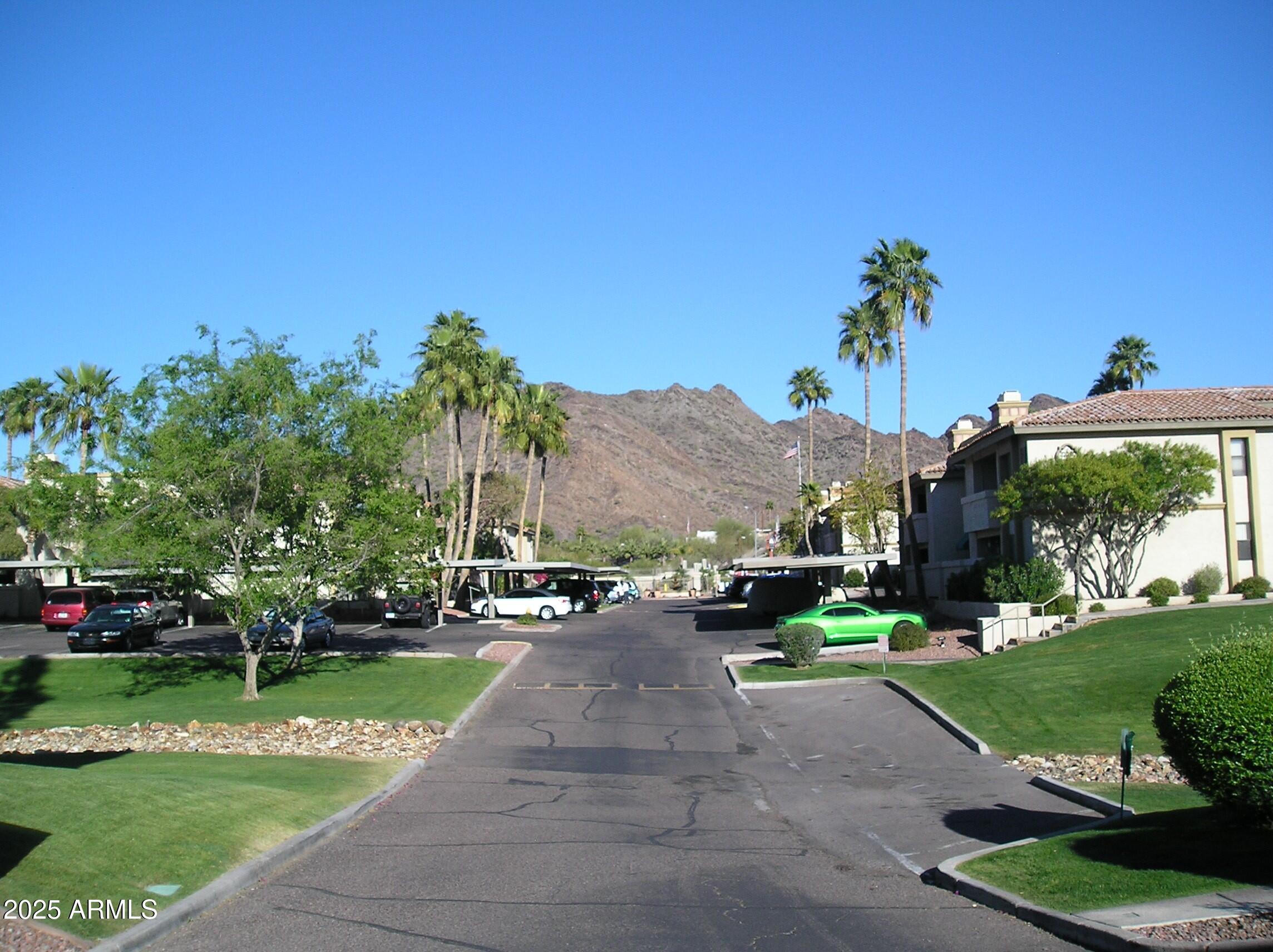 10410 North Cave Creek Road, Unit 1027 Phoenix, AZ 85020 - Photo 29 of 37 a childrens park with lots of swings and slides