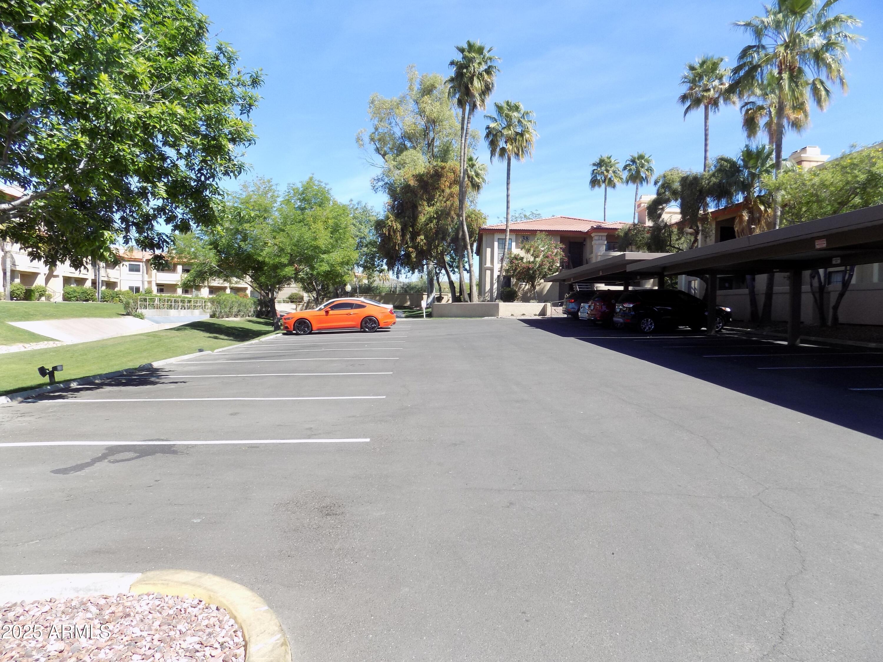 10410 North Cave Creek Road, Unit 1027 Phoenix, AZ 85020 - Photo 30 of 37 a view of street with parked cars