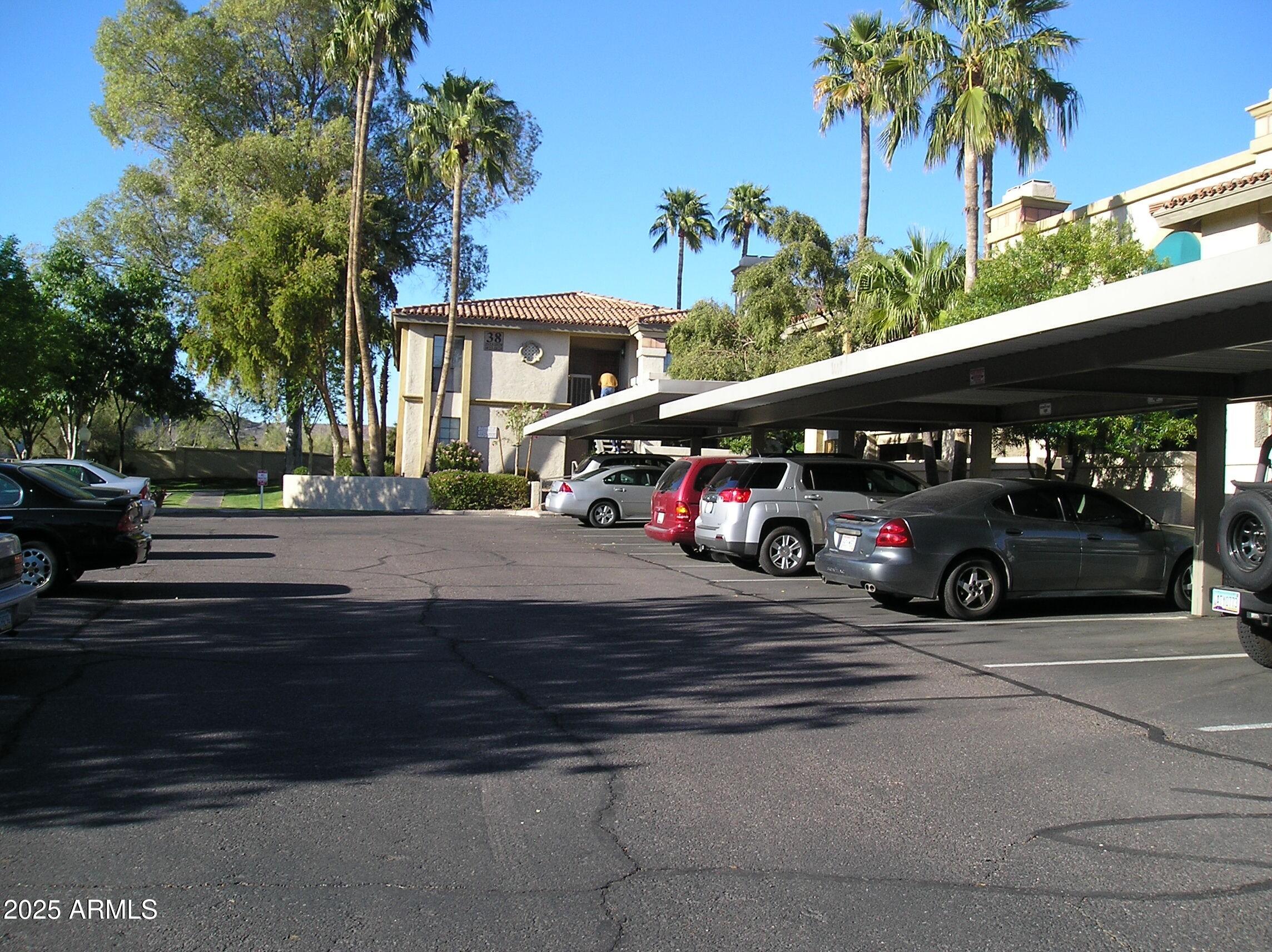 10410 North Cave Creek Road, Unit 1027 Phoenix, AZ 85020 - Photo 31 of 37 a view of street with parked cars