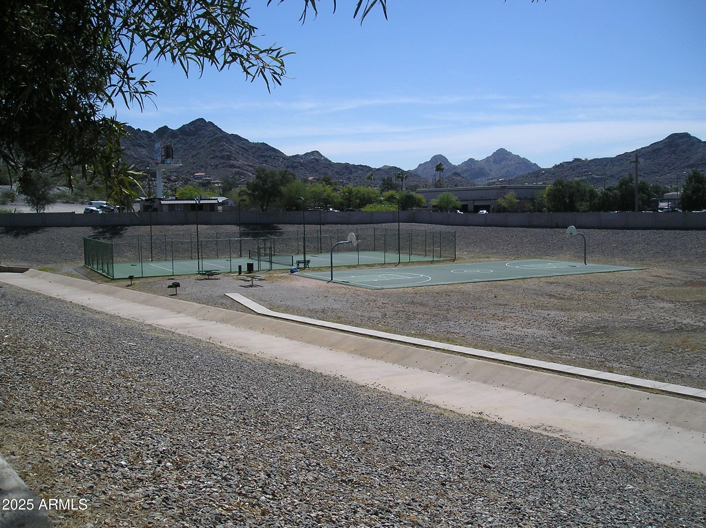 10410 North Cave Creek Road, Unit 1027 Phoenix, AZ 85020 - Photo 33 of 37 a view of lake with mountain in the background