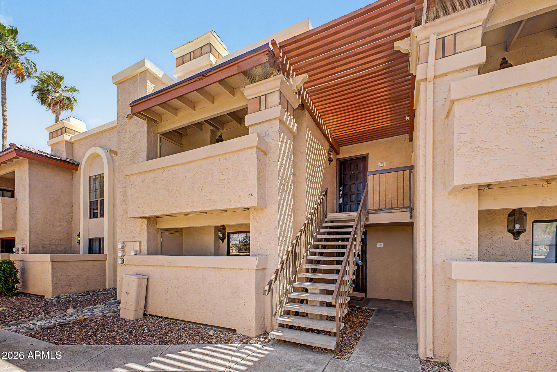 10410 North Cave Creek Road, Unit 1027 Phoenix, AZ 85020 - Photo 35 of 37 a view of a white building with many windows
