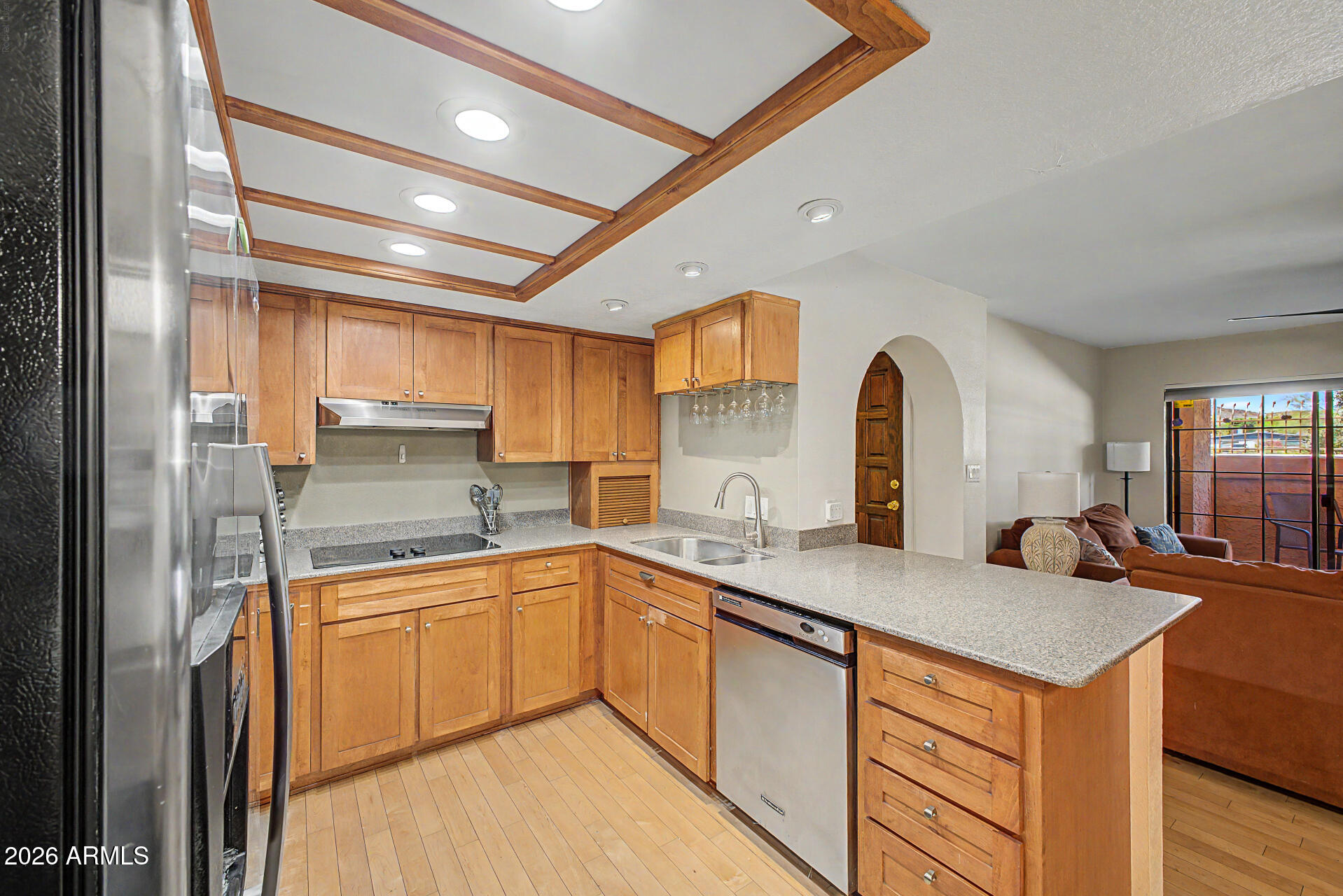 10410 North Cave Creek Road, Unit 1027 Phoenix, AZ 85020 - Photo 4 of 37 a kitchen with sink a refrigerator and cabinets