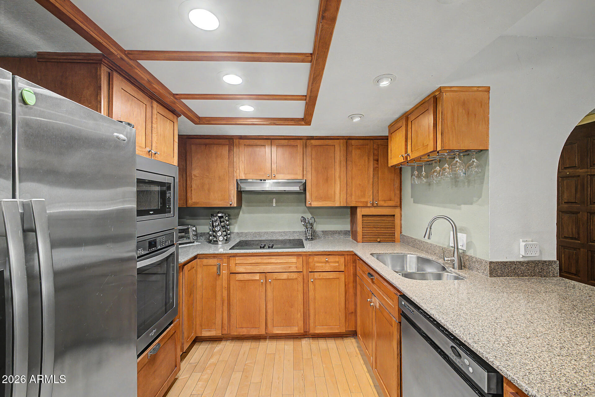 10410 North Cave Creek Road, Unit 1027 Phoenix, AZ 85020 - Photo 5 of 37 a kitchen with stainless steel appliances granite countertop a sink a stove and a refrigerator