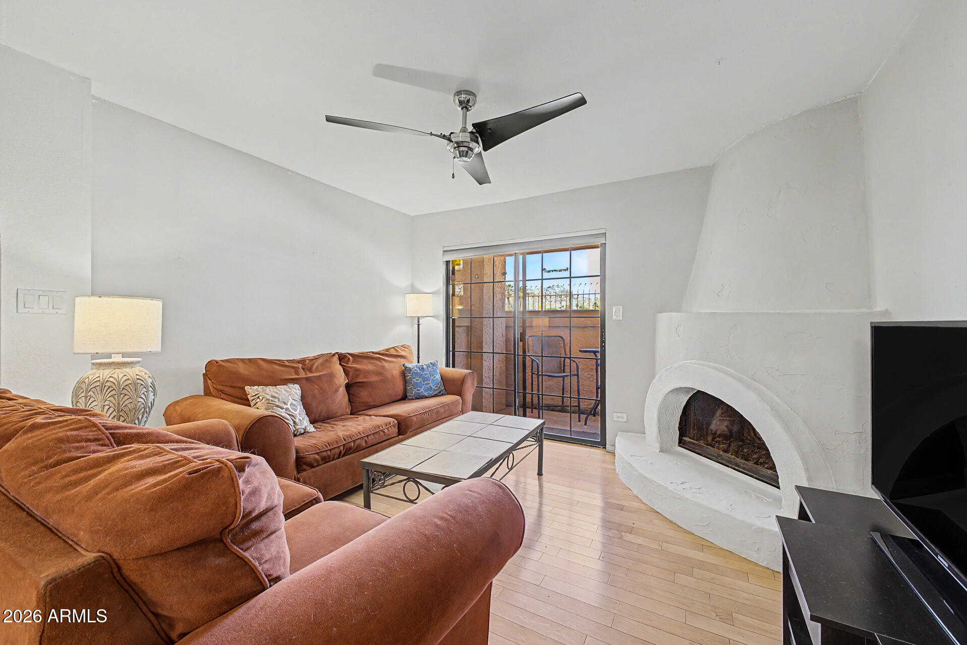 10410 North Cave Creek Road, Unit 1027 Phoenix, AZ 85020 - Photo 8 of 37 a living room with furniture fireplace and a flat screen tv