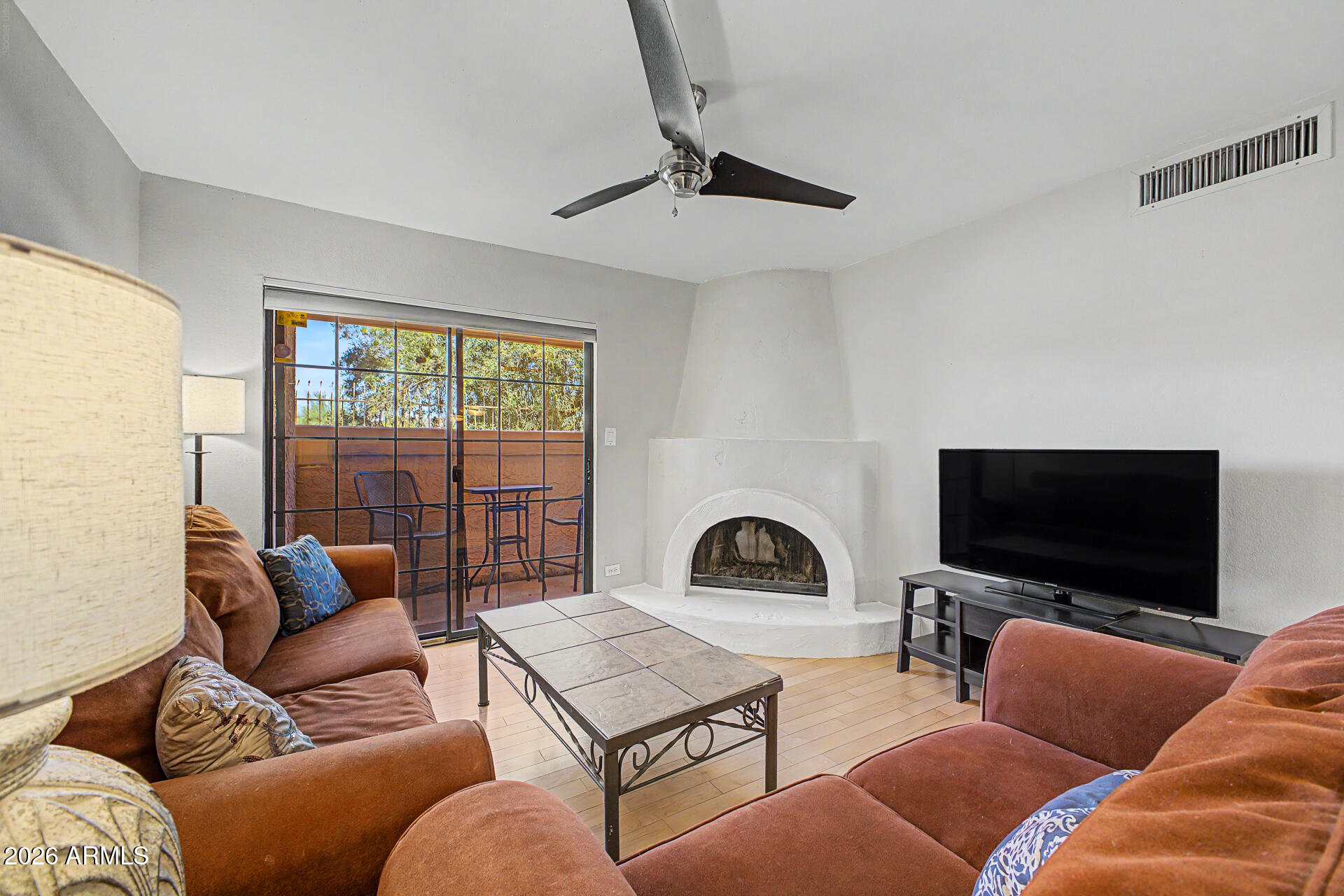 10410 North Cave Creek Road, Unit 1027 Phoenix, AZ 85020 - Photo 9 of 37 a living room with furniture and a flat screen tv