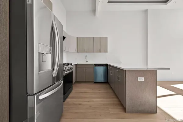 a kitchen with stainless steel appliances granite countertop a stove and a sink