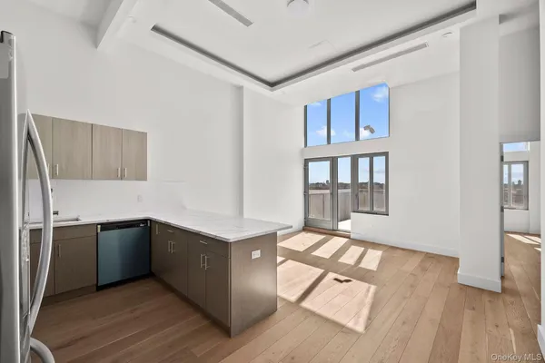 a view of kitchen with sink microwave and stove