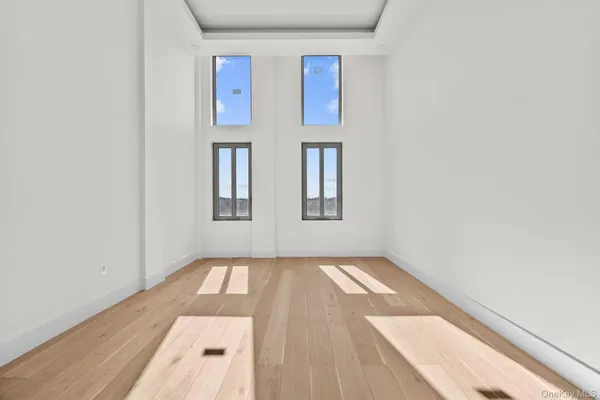 a bedroom with a bed couch and window