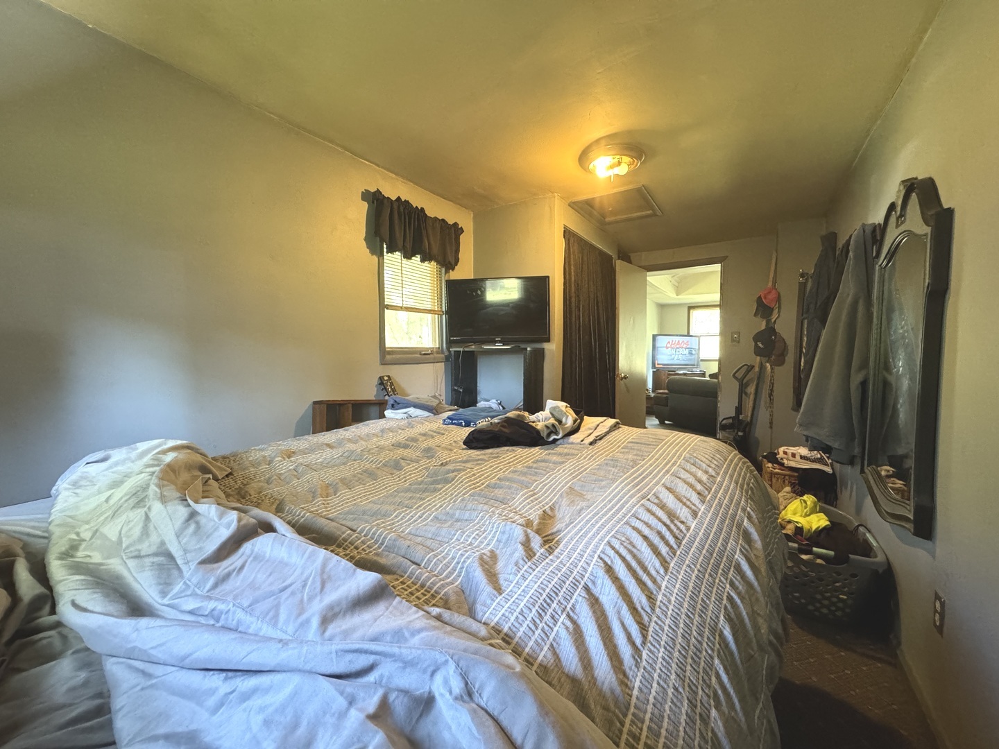 3239 3rd Avenue Momence, IL 60954 - Photo 6 of 8 a bedroom with a bed and dresser with mirror
