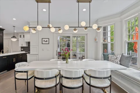 a view of a dining room and a table and chairs