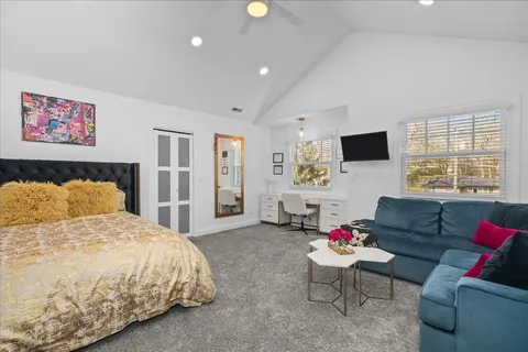 a bathroom with a granite countertop sink a toilet and shower