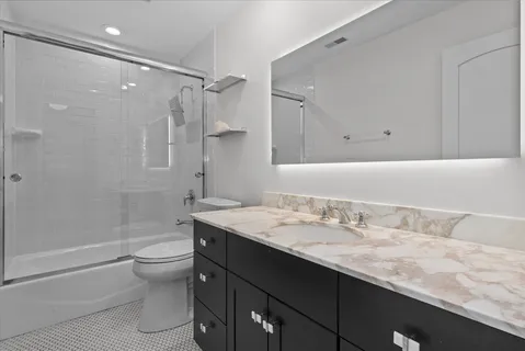 a bedroom with bed and window