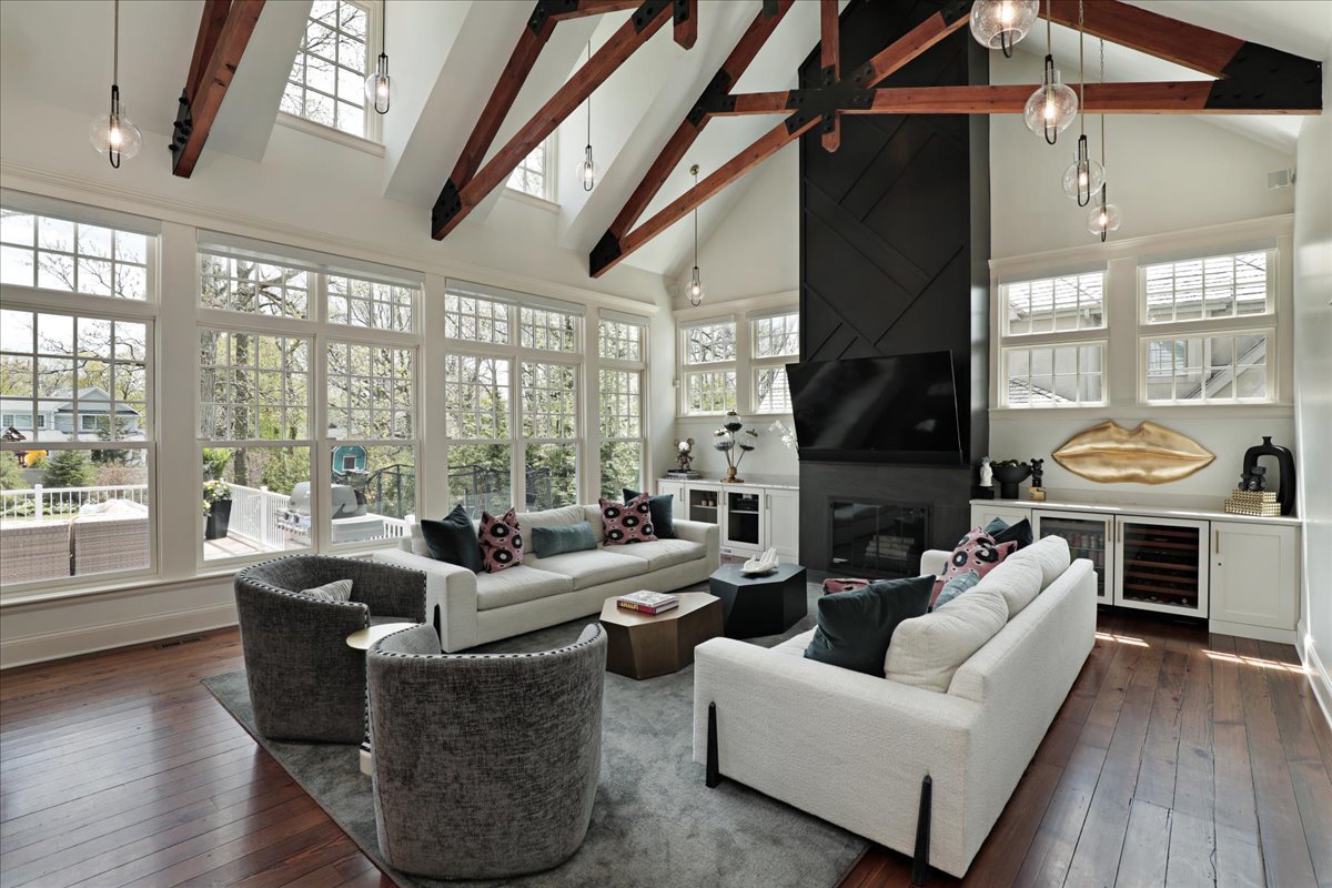 1423 Northwoods Road Deerfield, IL 60015 - Photo 4 of 39 a living room with fireplace furniture and a floor to ceiling window