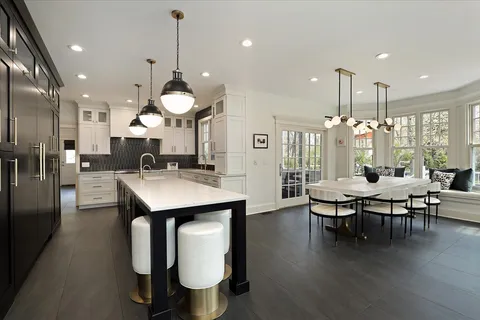 a dining room with furniture and wooden floor