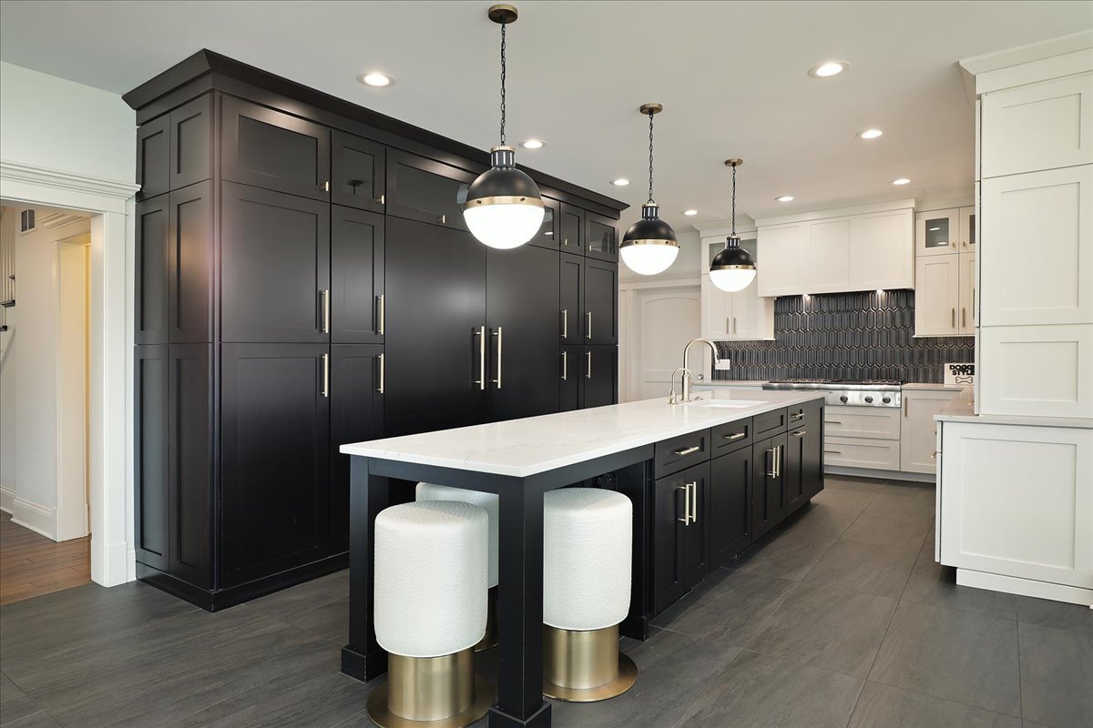 1423 Northwoods Road Deerfield, IL 60015 - Photo 8 of 39 a large kitchen with stainless steel appliances kitchen island granite countertop a stove a sink and a refrigerator