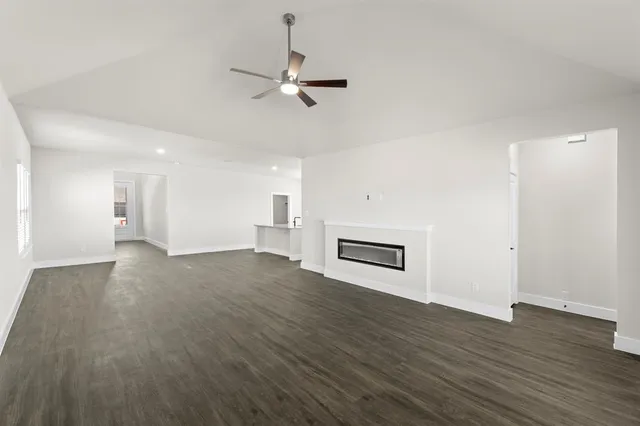 a view of a livingroom with wooden floor
