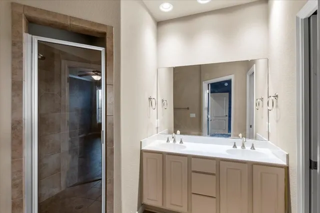 a bathroom with a double vanity sink and a mirror