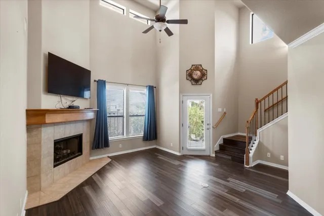 a view of an livingroom with furniture a flat screen tv and a fireplace