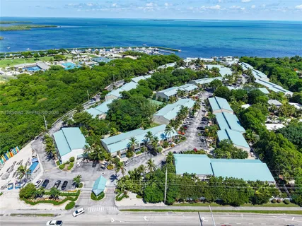an aerial view of swimming pool patio and outdoor seating