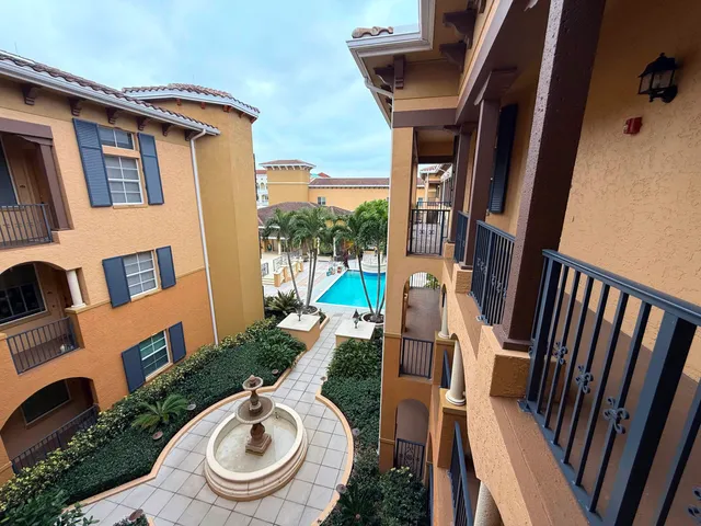 a bathroom with a sink a toilet a mirror a vanity and shower