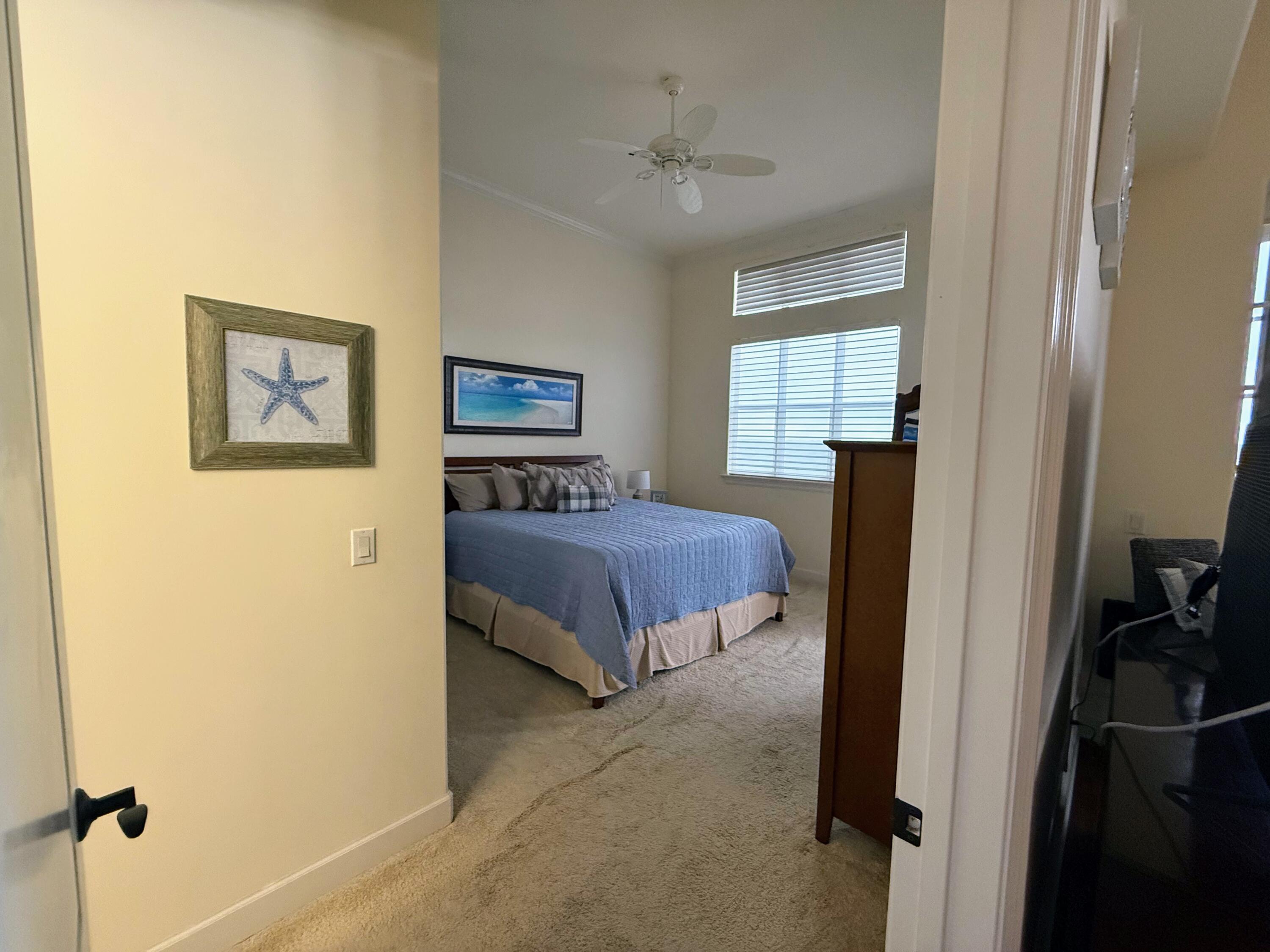 20 Orange Avenue, Unit 9 Fort Pierce, FL 34950 - Photo 65 of 92 a bedroom with a bed and a window